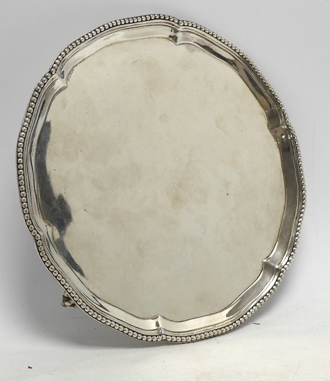 A George III silver waiter, by Jones & Scofield, London, 1777, with beaded border, on three claw and ball feet, 20.5oz, 13.3oz. Condition - poor